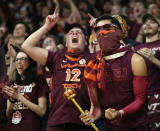 Virginia Tech fans in the student section "Cassell Guard" at the start of the team's NCAA college basketball game against Virginia on Wednesday, Feb. 26, 2020, in Blacksburg, Va. (Matt Gentry/The Roanoke Times via AP)