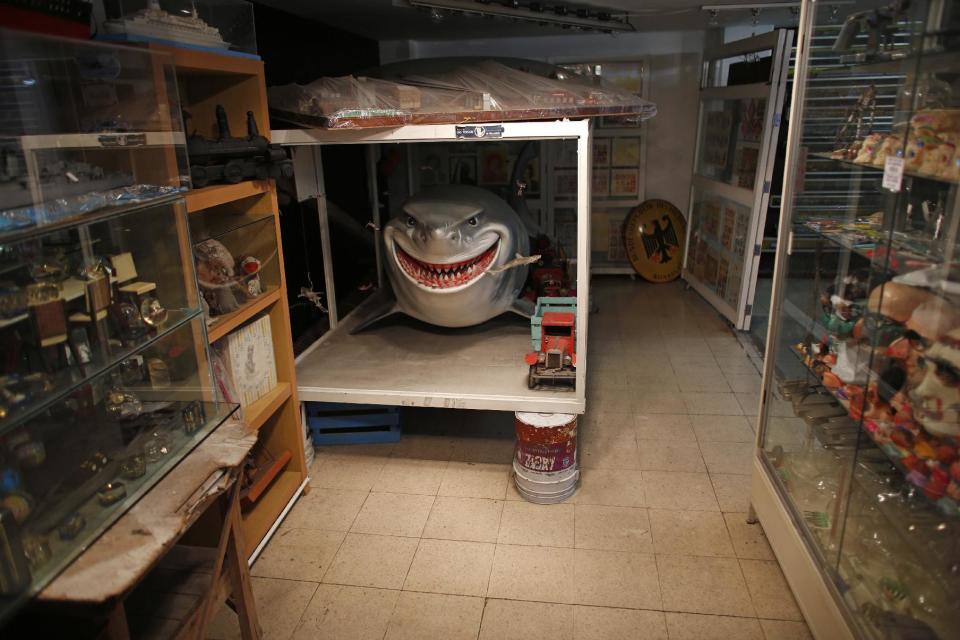 In this Jan. 11, 2017 photo, a toy shark is tucked into one of many corners at the Antique Toy Museum in Mexico City. Tucked in the middle of capital's historic but seedy Doctores neighborhood, the museum is stuffed with Legos, superhero action figures, robots, model airplanes, trains and dolls. (AP Photo/Dario Lopez-Mills)