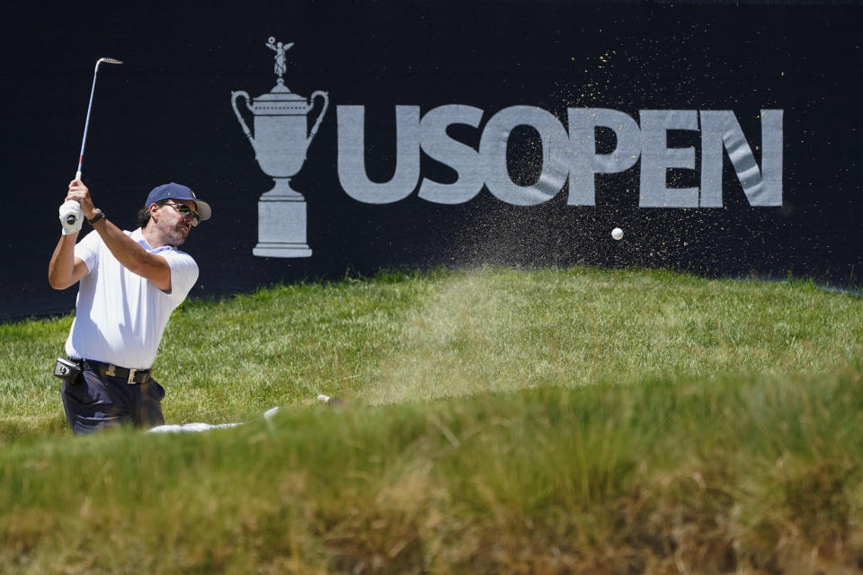 Phil Mickelson hits on the 16th hole during a practice round for the U.S. Open golf tournament at The Country Club, Wednesday, June 15, 2022, in Brookline, Mass. (AP Photo/Charles Krupa)