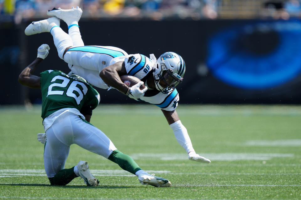 Carolina Panthers wide receiver Terrace Marshall Jr. is tackled by New York Jets cornerback Brandin Echols during the first half of an NFL football game Sunday, Sept. 12, 2021, in Charlotte, N.C. (AP Photo/Jacob Kupferman)