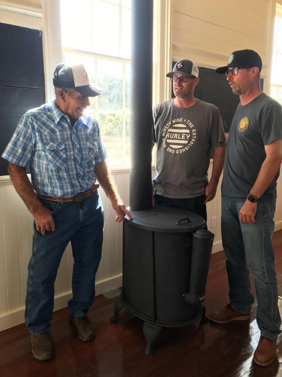 Lifelong Cambria rancher Oly Fiscalini, left, checks out the restoration work done by Brian and Paul Snow on an 1880s Northwest Stove Works stove that the Snows recently restored and reinstalled at the historic Santa Rosa School. The stove had been on Fiscalini’s ranch for decades, and he donated it to the Cambria Historical Society. The society owns, moved and restored the one-room schoolhouse and uses it as a demonstration museum for students.