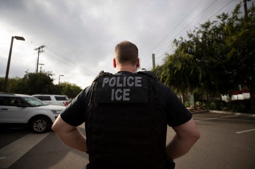 A U.S. Immigration and Customs Enforcement (ICE) officer looks on during an operation in Escondido, California, on July 8, 2019.