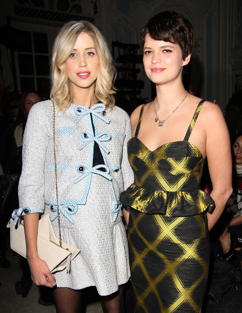 LONDON, ENGLAND - FEBRUARY 16:  Peaches Geldof and Pixie Geldof (R) attend the Moschino cheap&chic show during London Fashion Week Fall/Winter 2013/14 at The Savoy Hotel on February 16, 2013 in London, England.  (Photo by Danny Martindale/WireImage)