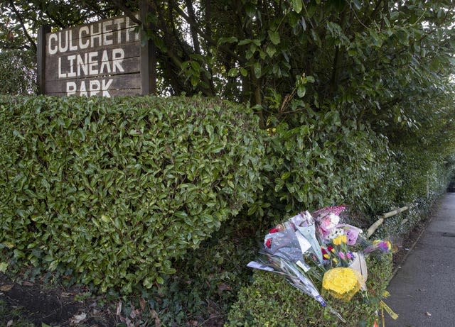 Floral tributes at the scene in Culcheth Linear Park in Warrington