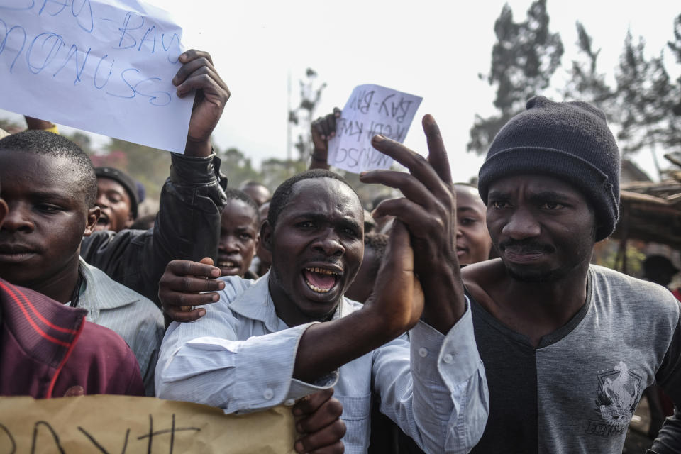 Demonstrators face off with police during a protest against the United Nations peacekeeping force (MONUSCO) deployed in the Democratic Republic of the Congo in Sake, some 15 miles (24 kms) west of Goma, Wednesday July 27, 2022. Officials say more than 15 people have been killed and dozens injured during the demonstrations against the UN mission in the country, heading into their third day. (AP Photo/Moses Sawasawa)