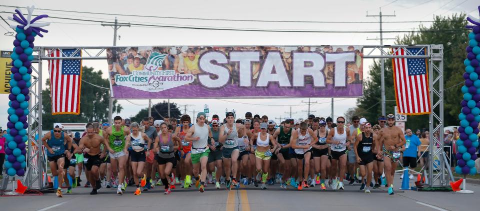 Participants take off at the start of the Community First Fox Cities Marathon Presented by Miron Construction on Sunday.