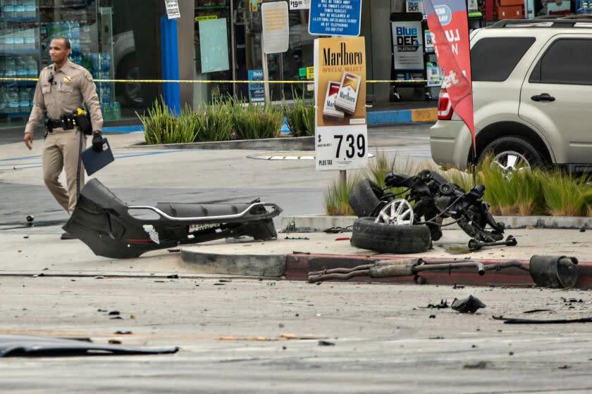 LOS ANGELES, CA - AUGUST 04: CHP and other officials investigate a fiery crash where multiple people were killed near a Windsor Hills gas station at the intersection of West Slauson and South La Brea avenues on Thursday, Aug. 4, 2022 in Los Angeles, CA. (Jason Armond / Los Angeles Times)