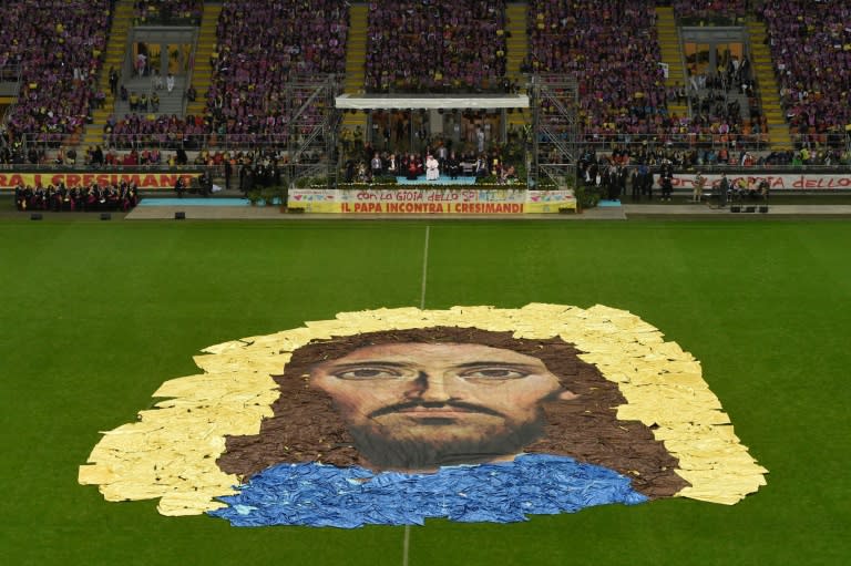 A portrait of Christ is represented on the football pitch of the stadium where young people rallied with octogenarian Pope Francis