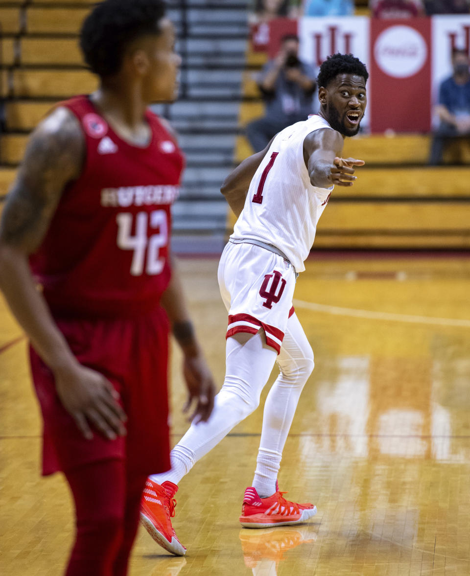 Indiana guard Al Durham (1) reacts towards Rutgers guard Jacob Young (42) after Young failed to block Durham's 3-point shot during the second half of an NCAA college basketball game, Sunday, Jan. 24, 2021, in Bloomington, Ind. (AP Photo/Doug McSchooler)