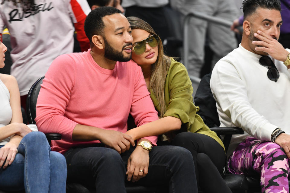 John Legend and Chrissy Teigen attend a basketball game between the Los Angeles Clippers and the Los Angeles Lakers at Staples Center on March 08, 2020 in Los Angeles, California. (Photo by Allen Berezovsky/Getty Images)