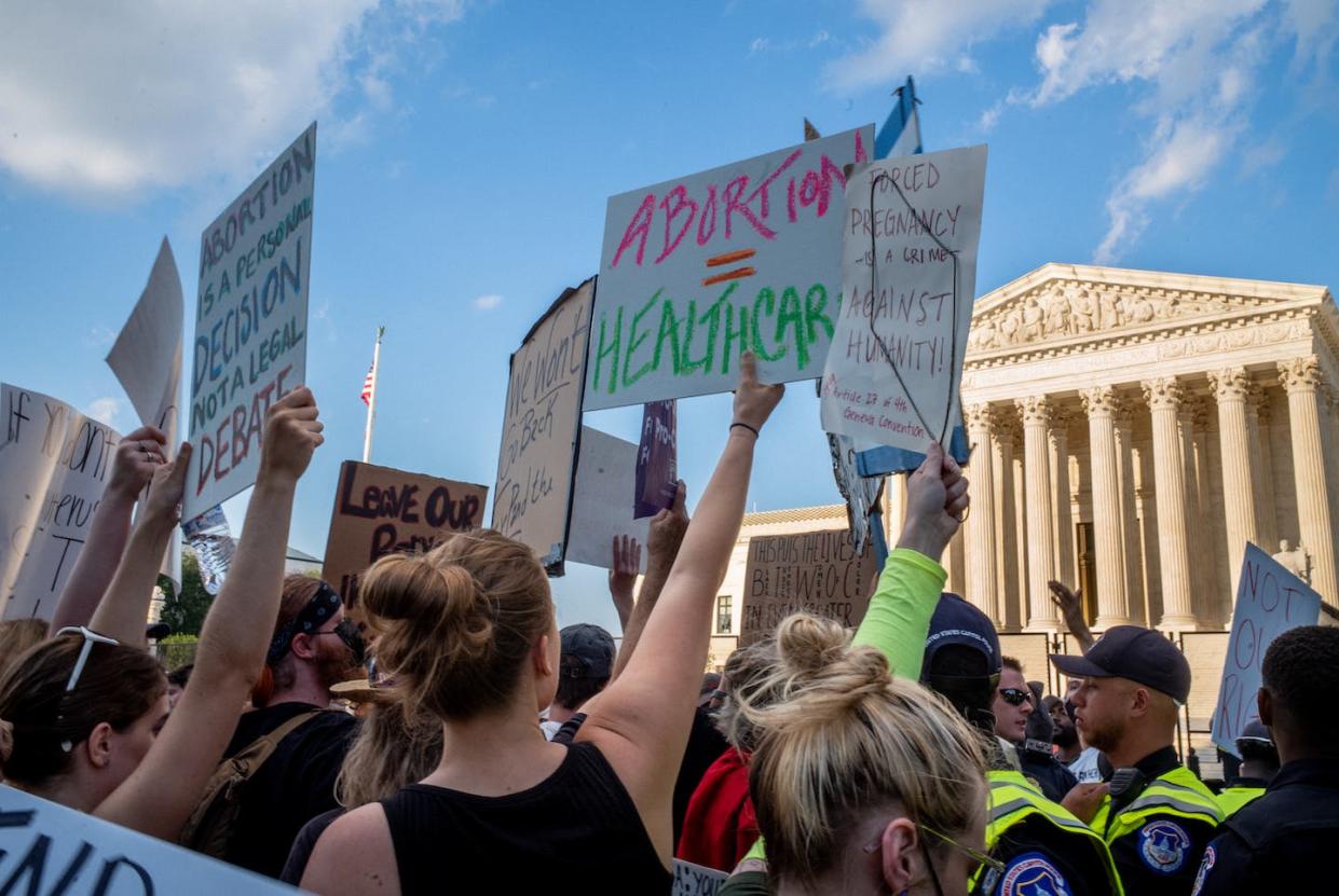 Abortion-rights demonstrators protest in front of the Supreme Court building on June 25, 2022, a day after the announcement of the Dobbs v. Jackson Women's Health Organization ruling. <a href="https://www.gettyimages.com/detail/news-photo/abortion-rights-demonstrators-protest-in-front-of-the-news-photo/1405134629?adppopup=true" rel="nofollow noopener" target="_blank" data-ylk="slk:Brandon Bell/Getty Images News via Getty Images;elm:context_link;itc:0;sec:content-canvas" class="link ">Brandon Bell/Getty Images News via Getty Images</a>