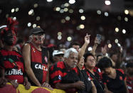 Fans take part in an homage for the 10 teenage players killed by a fire at the Flamengo training center last Friday, ahead of a soccer match between Flamengo and Fluminense at the Maracana Stadium, in Rio de Janeiro, Brazil, Thursday, Feb. 14, 2019. (AP Photo/Leo Correa)