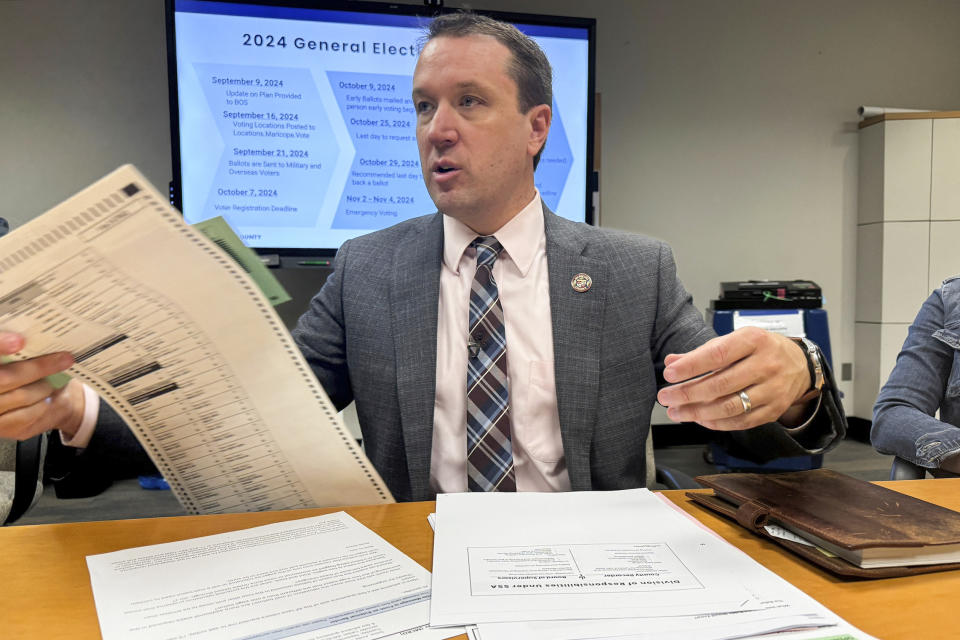 Maricopa County Elections Director Scott Jarrett explains the new two-page ballot that Arizona voters will have to contend with this year, Tuesday, Sept. 10, 2024, in Phoenix. (AP Photo/Gabriel Sandoval)