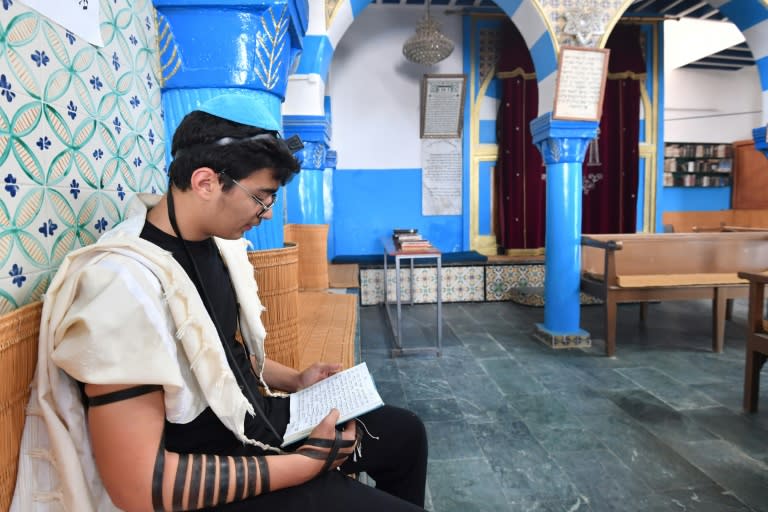 A Tunisian man prays at a synagogue in Djerba during an annual Jewish pilgrimage (FETHI BELAID)