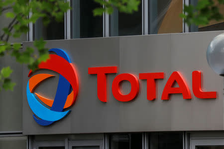 The logo of French oil giant Total is seen at La Defense business and financial district in Courbevoie, near Paris, France. May 16, 2018. REUTERS/Charles Platiau