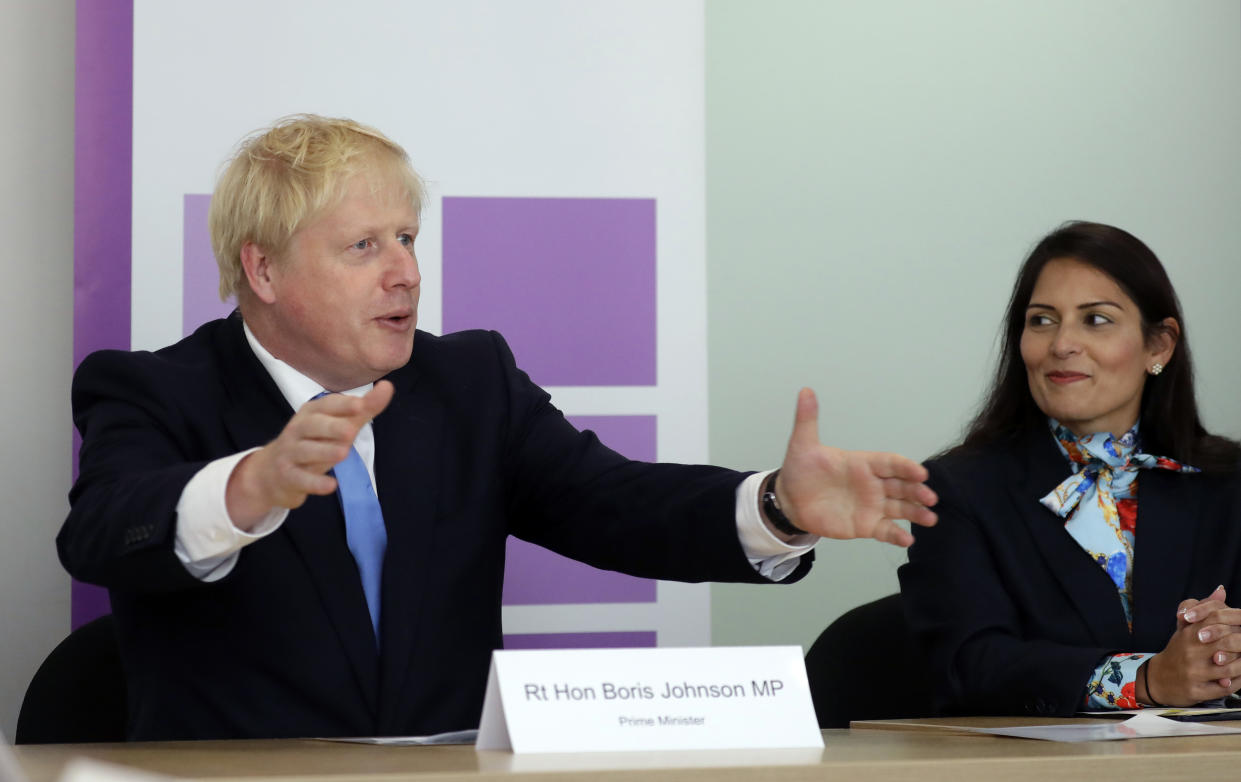 Prime Minister Boris Johnson with Home Secretary Priti Patel attending the first meeting of the National Policing Board at the Home Office in London.