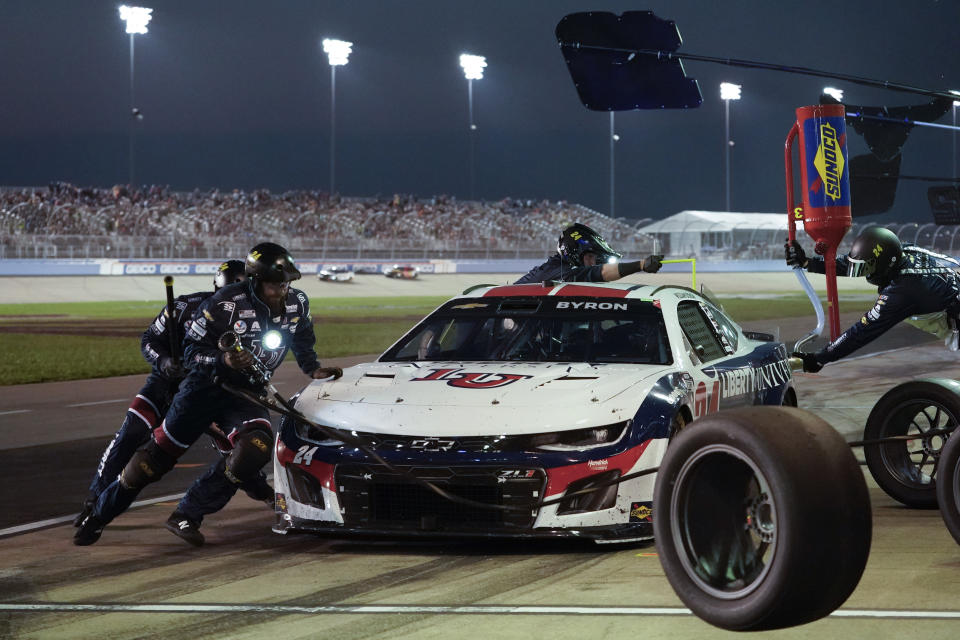 The pit crew works on William Byron's car during a NASCAR Cup Series auto race, Sunday, June 25, 2023, in Lebanon, Tenn. (AP Photo/George Walker IV)