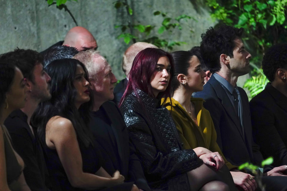 Dua Lipa, center, attends the Gucci Cruise fashion show in London, Monday, May 13, 2024. (Photo by Alberto Pezzali/Invision/AP)