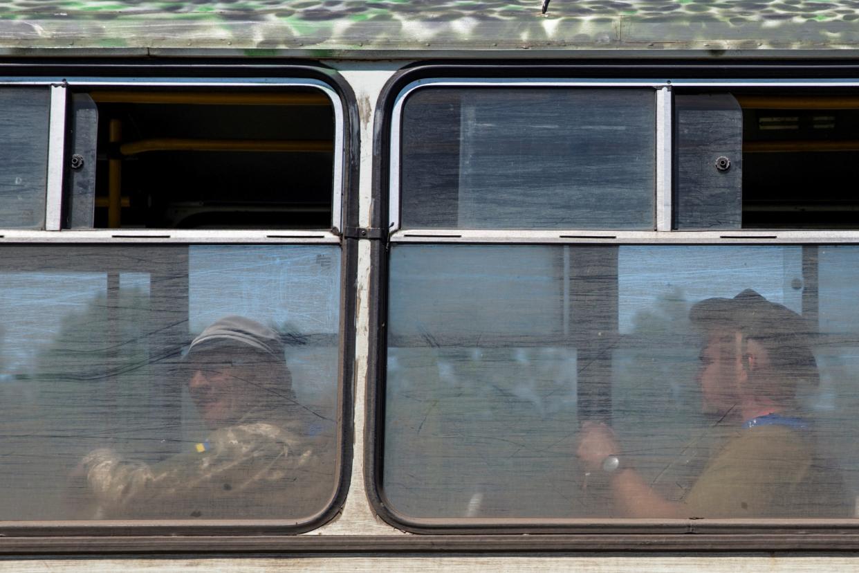 Ukrainian service members are seen inside a bus at a training ground near a frontline, amid Russia&#39;s attack on Ukraine, in Donetsk region (REUTERS)