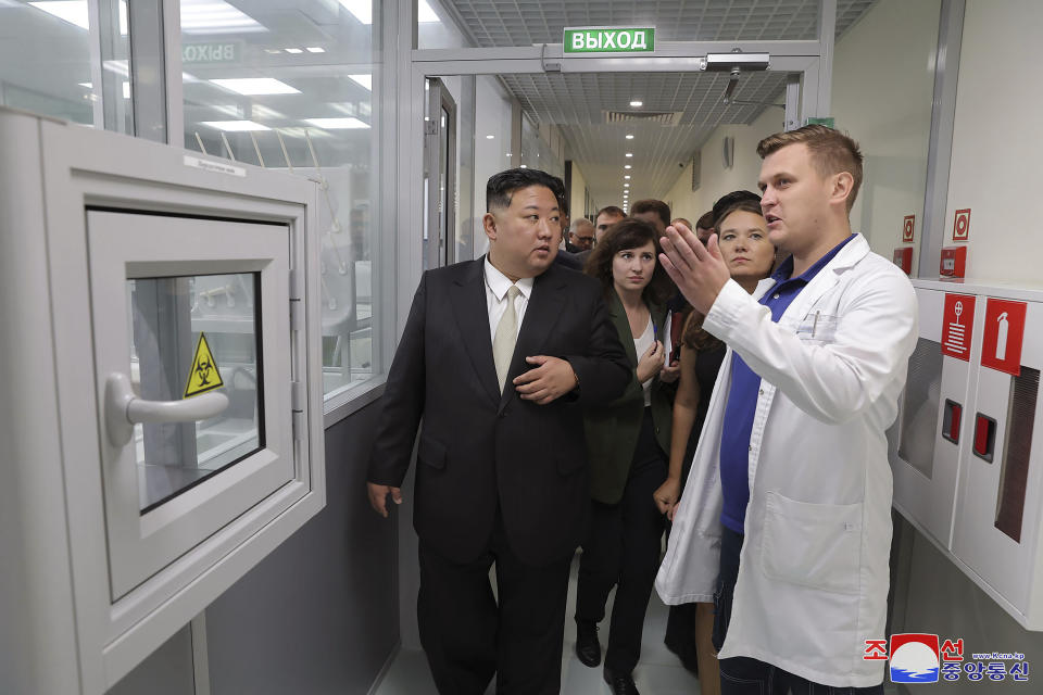 In this photo provided by the North Korean government, North Korea leader Kim Jong Un, front left, visits the Arnika Bio-Feed Mill in Vladivostok, Russian Far East Sunday, Sept. 17, 2023. Independent journalists were not given access to cover the event depicted in this image distributed by the North Korean government. The content of this image is as provided and cannot be independently verified. Korean language watermark on image as provided by source reads: "KCNA" which is the abbreviation for Korean Central News Agency. (Korean Central News Agency/Korea News Service via AP)