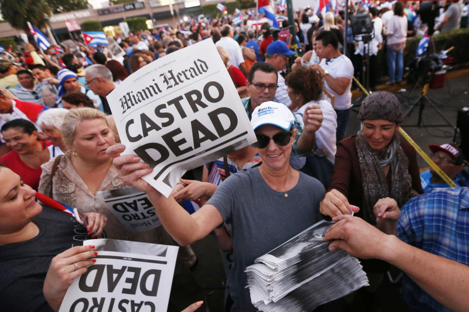 Alexandra Villoch, president and publisher of the Miami Herald Media Company, hands out a special edition of the Miami Herald with the headline 