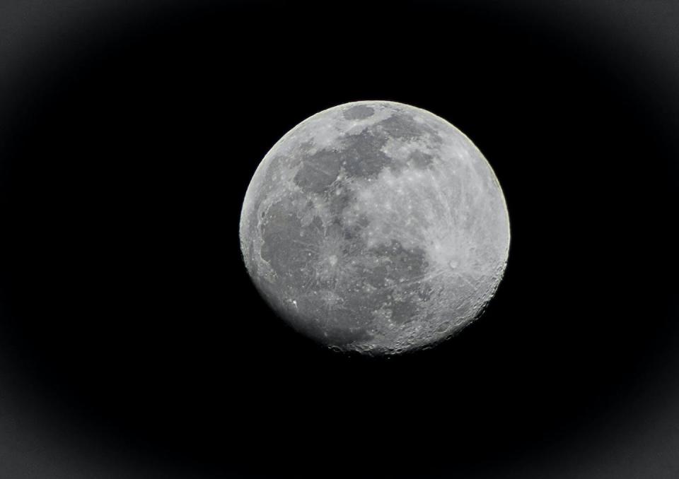 On a clear night, you can see the Moon’s two geologic regions – the darker maria and the lighter highlands. Shutterstock