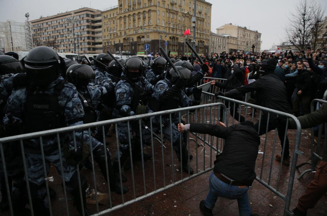 <span class="caption">Russian police officers beat people protesting the jailing of opposition leader <span class="caas-xray-inline-tooltip"><span class="caas-xray-inline caas-xray-entity caas-xray-pill rapid-nonanchor-lt" data-entity-id="Alexei_Navalny" data-ylk="cid:Alexei_Navalny;pos:1;elmt:wiki;sec:pill-inline-entity;elm:pill-inline-text;itc:1;cat:OfficeHolder;" tabindex="0" aria-haspopup="dialog"><a href="https://search.yahoo.com/search?p=Alexei%20Navalny" data-i13n="cid:Alexei_Navalny;pos:1;elmt:wiki;sec:pill-inline-entity;elm:pill-inline-text;itc:1;cat:OfficeHolder;" tabindex="-1" data-ylk="slk:Alexei Navalny;cid:Alexei_Navalny;pos:1;elmt:wiki;sec:pill-inline-entity;elm:pill-inline-text;itc:1;cat:OfficeHolder;" class="link ">Alexei Navalny</a></span></span>, Jan. 23, 2021 in Moscow.</span> <span class="attribution"><a class="link " href="https://www.gettyimages.com/detail/news-photo/russian-policemen-beat-participants-of-an-unauthorized-news-photo/1230750514?adppopup=true" rel="nofollow noopener" target="_blank" data-ylk="slk:Mikhail Svetlov/Getty Images);elm:context_link;itc:0;sec:content-canvas">Mikhail Svetlov/Getty Images)</a></span>