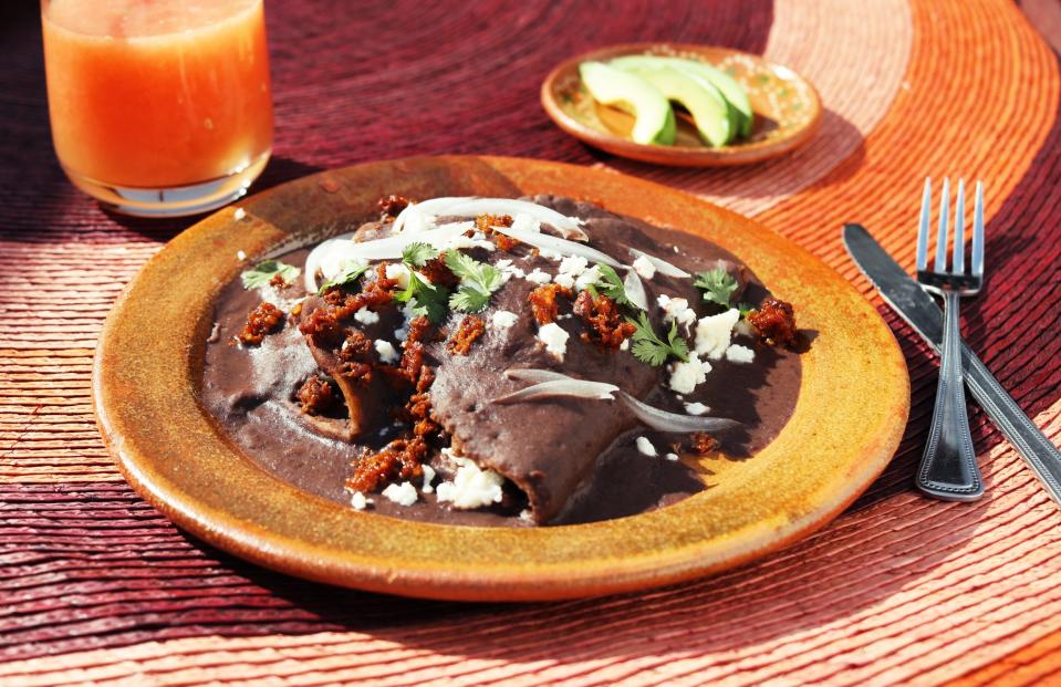 You might normally make enfrijoladas by dipping stale tortillas into leftover frijoles from the night before, but when you don't have cooked beans on hand, this recipe will walk you through the process, starting with canned beans. <a href="https://www.epicurious.com/recipes/food/views/enfrijoladas?mbid=synd_yahoo_rss" rel="nofollow noopener" target="_blank" data-ylk="slk:See recipe.;elm:context_link;itc:0" class="link ">See recipe.</a>