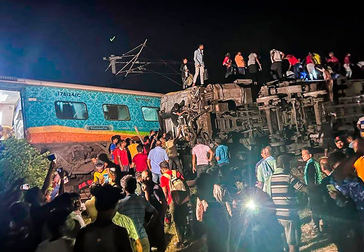 Rescuers are attempting to free 200 people feared trapped in the wreckage (Press Trust of India)