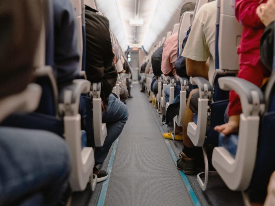 A packed airplane cabin.