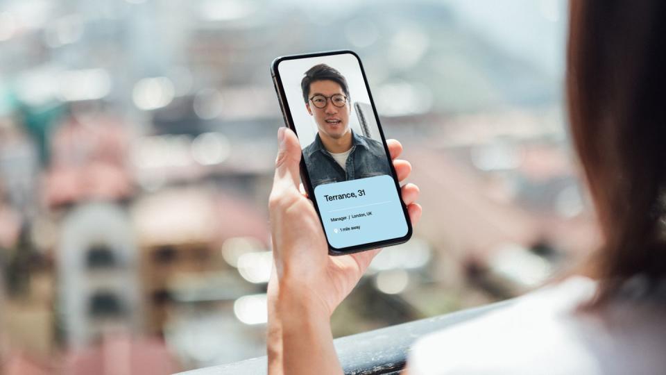 young woman using dating app on smart phone