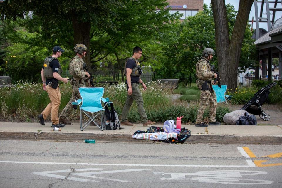 PHOTO: Law enforcement works the scene after a mass shooting at a Fourth of July parade, July 4, 2022, in Highland Park, Ill. (Jim Vondruska/Getty Images)