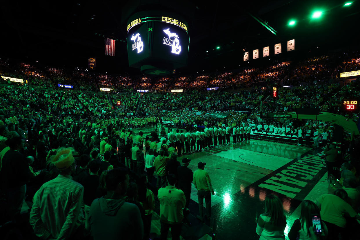 ANN ARBOR, MICHIGAN - FEBRUARY 18: Crisler Arena is lit up green during a moment of silence to support for those affected by the shootings on the Michigan State campus prior to a basketball game between the Michigan State Spartans and Michigan Wolverines at Crisler Arena on February 18, 2023 in Ann Arbor, Michigan. (Photo by Gregory Shamus/Getty Images)