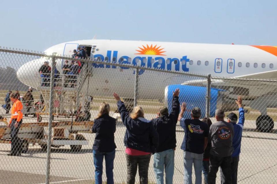 Supporters wave as veterans for an Honor Flight of the Central Coast mission board a charter plane on Monday, April 24, 2023, at the Santa Maria Public Airport. More than 70 veterans and their escorts will return Wednesday night after a whirlwind tour of memorials in Washington, D.C.