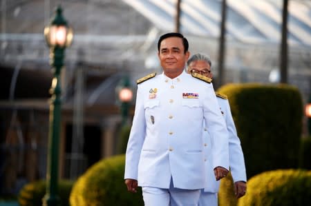Thailand's Prime Minister Prayuth Chan-ocha arrives for a photo session with the new government cabinet in Bangkok