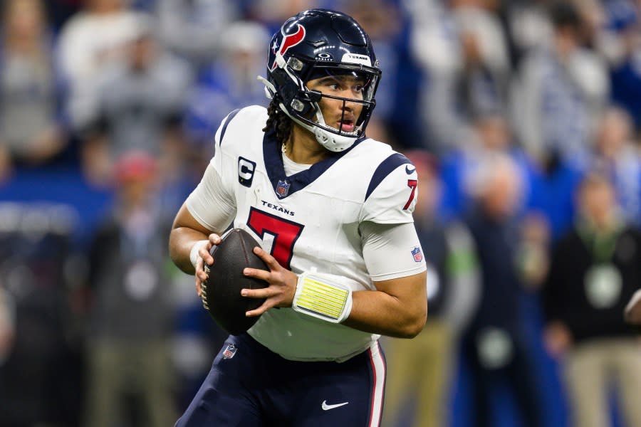 Houston Texans quarterback C.J. Stroud (7) scrambles from pressure during an NFL football game against the Indianapolis Colts, Saturday, Jan. 6, 2024, in Indianapolis. (AP Photo/Zach Bolinger)