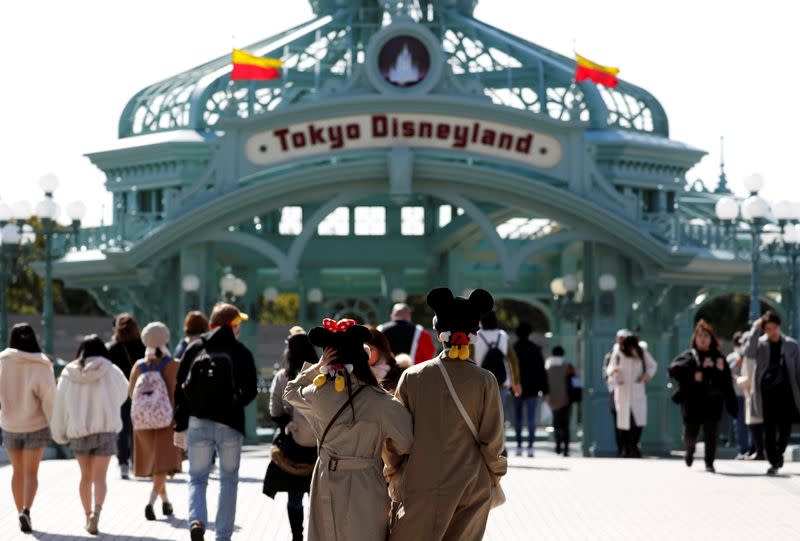 Visitors are seen outside Tokyo Disneyland in Urayasu