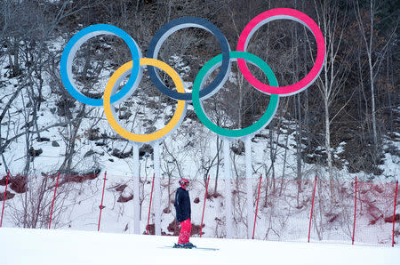 FILE PHOTO: Alpine Skiing – Pyeongchang 2018 Winter Olympics – Men’s Downhill – Jeongseon Alpine Centre - Pyeongchang, South Korea – February 11, 2018 - The Olympics rings are seen at the Alpine venue after the men's downhill was postponed due to strong winds. REUTERS/Mike Segar/File Photo