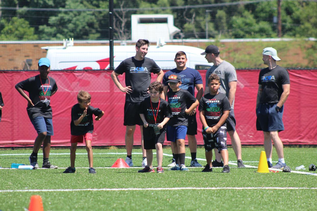 Students at the Pioneer Leadership/Exploratory Sports Camp get ready to race each other during the track anf field events at Malone University.