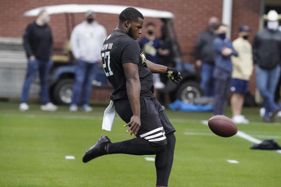 FILE - In this March 16, 2021, file photo, Georgia Tech punter Pressley Harvin III punts the ball during the school's Pro Day football workout for NFL scouts in Atlanta. NFL scouts who gathered for Georgia Tech’s pro day didn’t just want to see 263-pound punter Pressley Harvin boot the ball a mile. They also asked him to throw some passes, and he dazzled them with his arm, too. (AP Photo/Brynn Anderson, File)