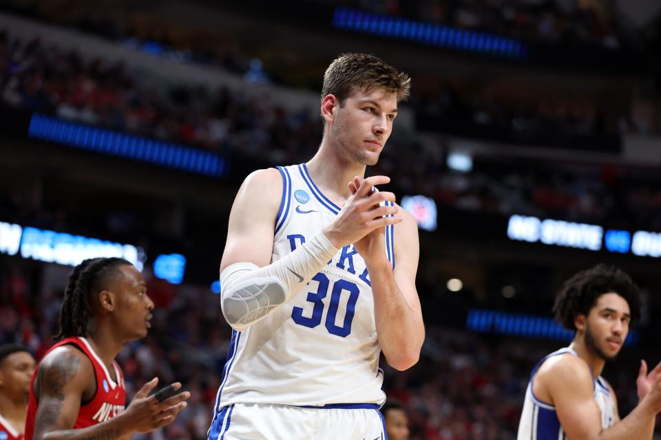 Mar 31, 2024; Dallas, TX, USA; Duke Blue Devils center Kyle Filipowski (30) reacts in the first half against the North Carolina State Wolfpack in the finals of the South Regional of the 2024 NCAA Tournament at American Airline Center. Mandatory Credit: Tim Heitman-USA TODAY Sports