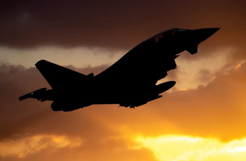 An air force Eurofighter Typhoon fighter aircraft takes off from Wittmundhafen airbase in front of the rising sun. A Russian reconnaissance aircraft flying without a detection signal was spotted over the Baltic Sea off Germany, prompting fighter jets to be scrambled. An emergency patrol was sent up from the Laage Air Base in north-eastern Germany, the Luftwaffe said on 30 January. Hauke-Christian Dittrich/dpa