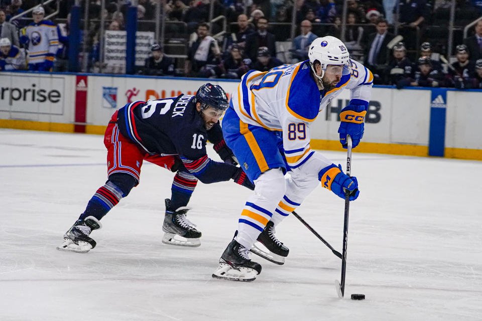 Buffalo Sabres right wing Alex Tuch (89) is pursued by New York Rangers center Vincent Trocheck (16) during the third period of an NHL hockey game in New York, Saturday, Dec. 23, 2023. (AP Photo/Peter K. Afriyie)