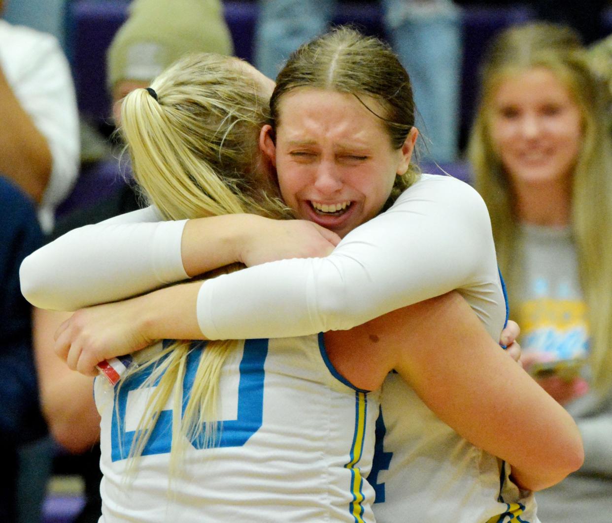 Ally Abraham hugs her cousin Kami Wadsworth after Hamlin High School's girls basketball team defeated Wagner 58-55 in the championship game of the state Class A tournament on Saturday, March 11, 2023 in the Watertown Civic Arena.