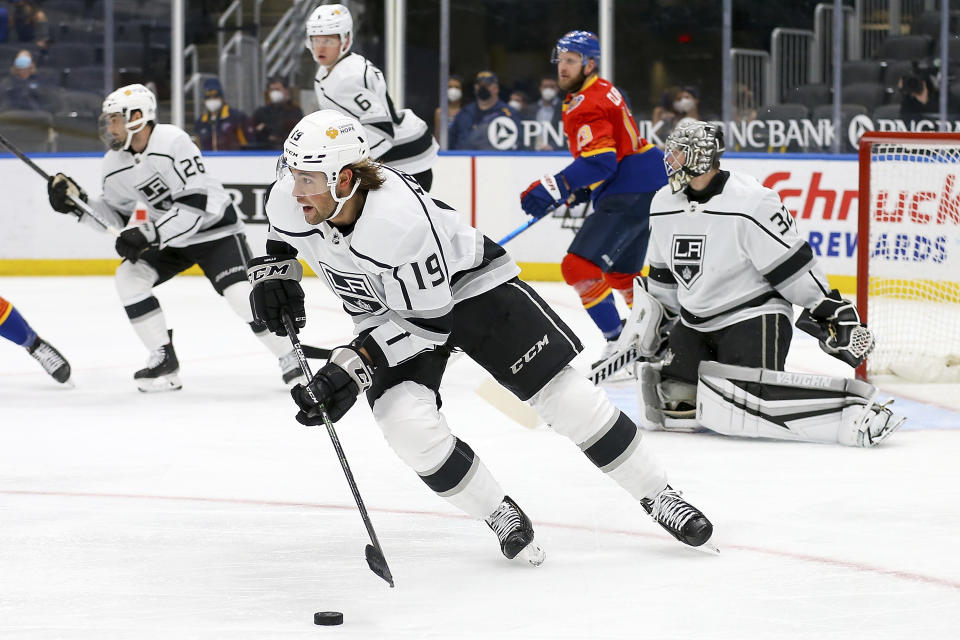 Los Angeles Kings' Alex Iafallo (19) drives the puck down the ice during the second period of an NHL hockey game against the St. Louis Blues Monday, Feb. 22, 2021, in St. Louis. (AP Photo/Scott Kane)