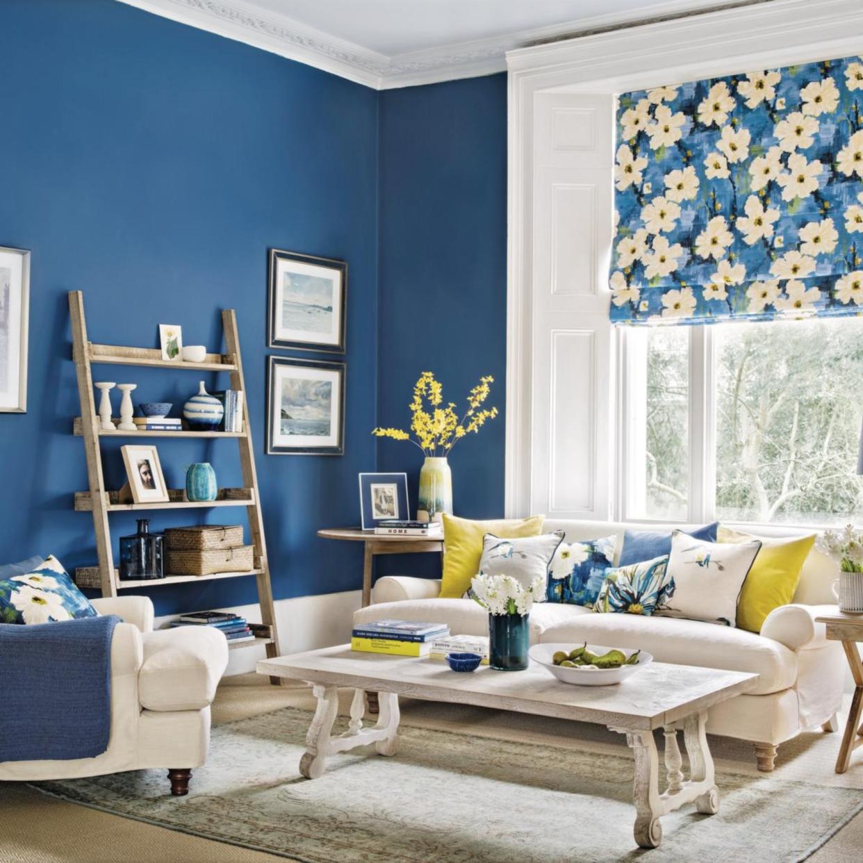  A calm and decluttered living room, painted in French blue 