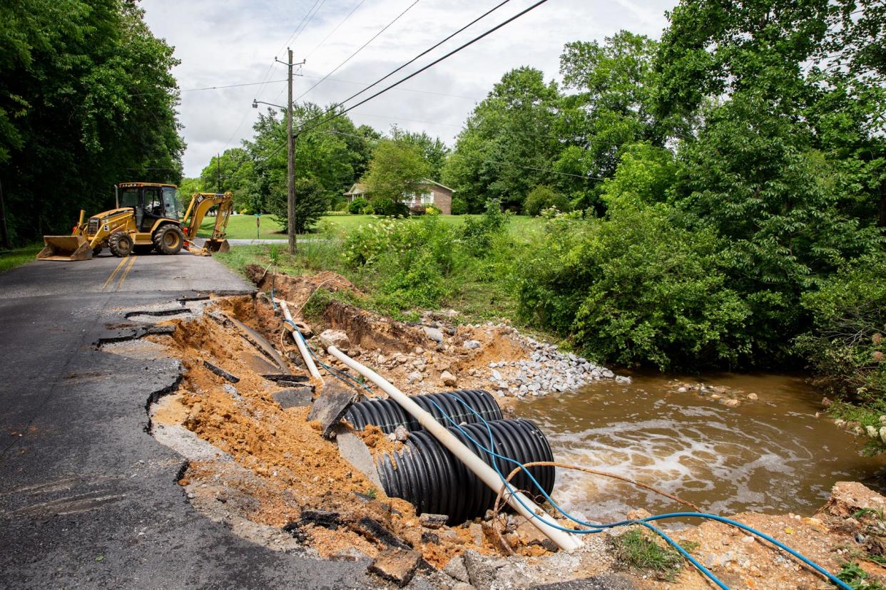 A section of McLain Street in Hokes Bluff is broken apart by the unexpected summer storm that hit the Etowah County area on Tuesday, June 7, 2022.