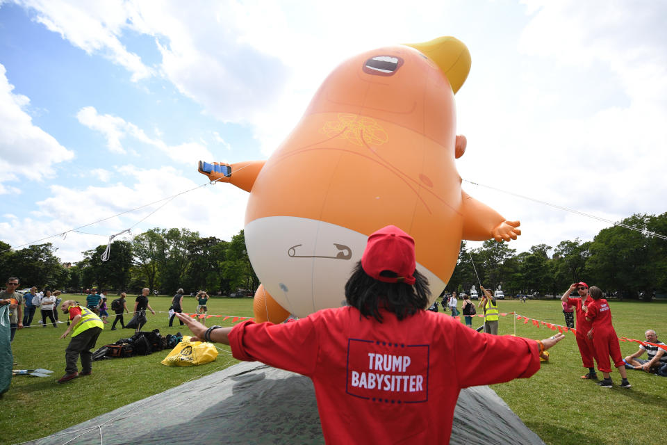 <p>Workers tend to the “Trump baby” balloon on July 14, 2018 in Edinburgh, Scotland. (Photo: Jeff J. Mitchell/Getty Images) </p>