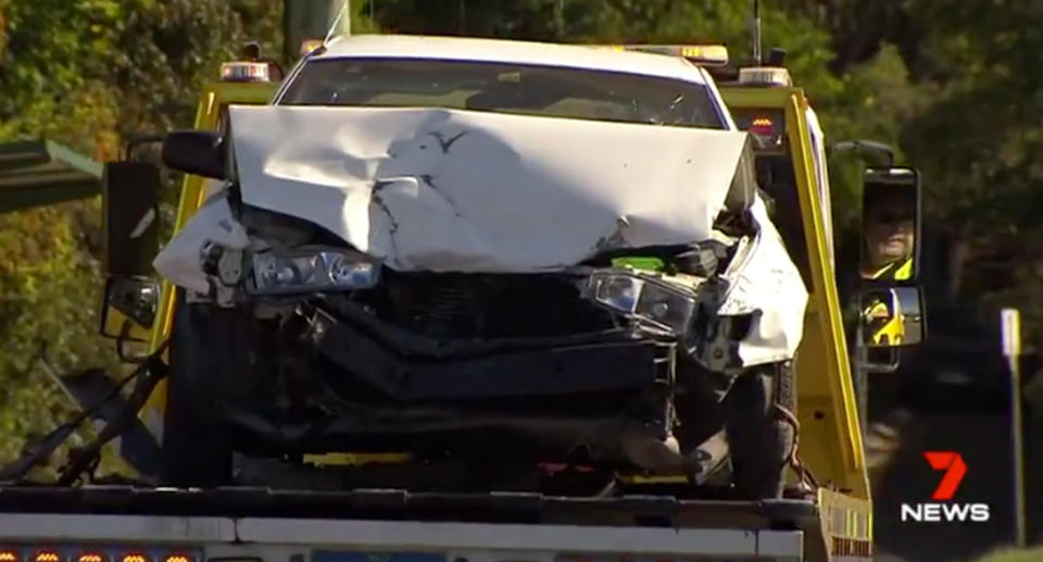 Police tow the car away. Source: 7News