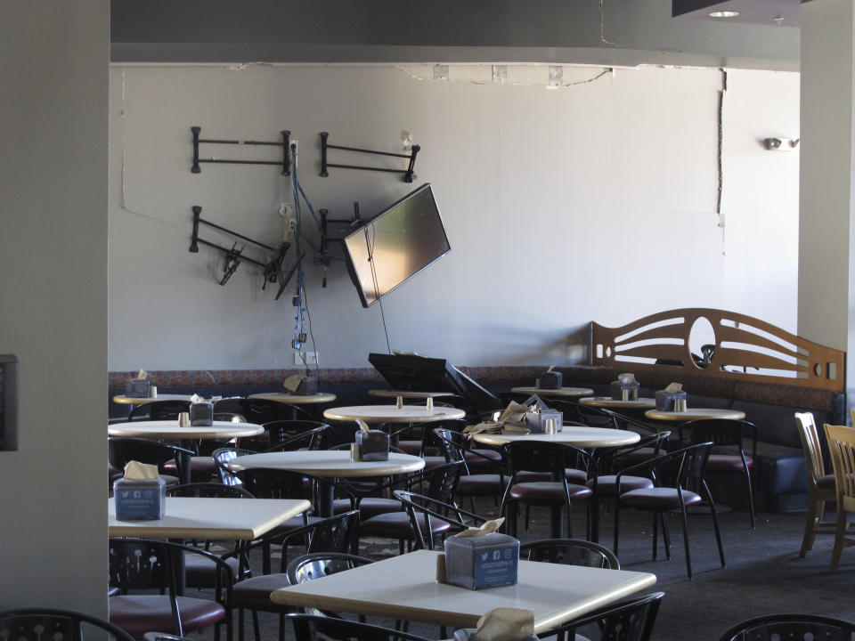 Damage is seen in the first-floor cafeteria at a University of Nevada, Reno dormitory, Thursday, July 11, 2019, in Reno, Nev., where a July 5 natural gas explosion blew out walls and windows. School officials gave members of the media their first up-close look at the exterior and interior damage on Thursday. (AP Photo/Scott Sonner)